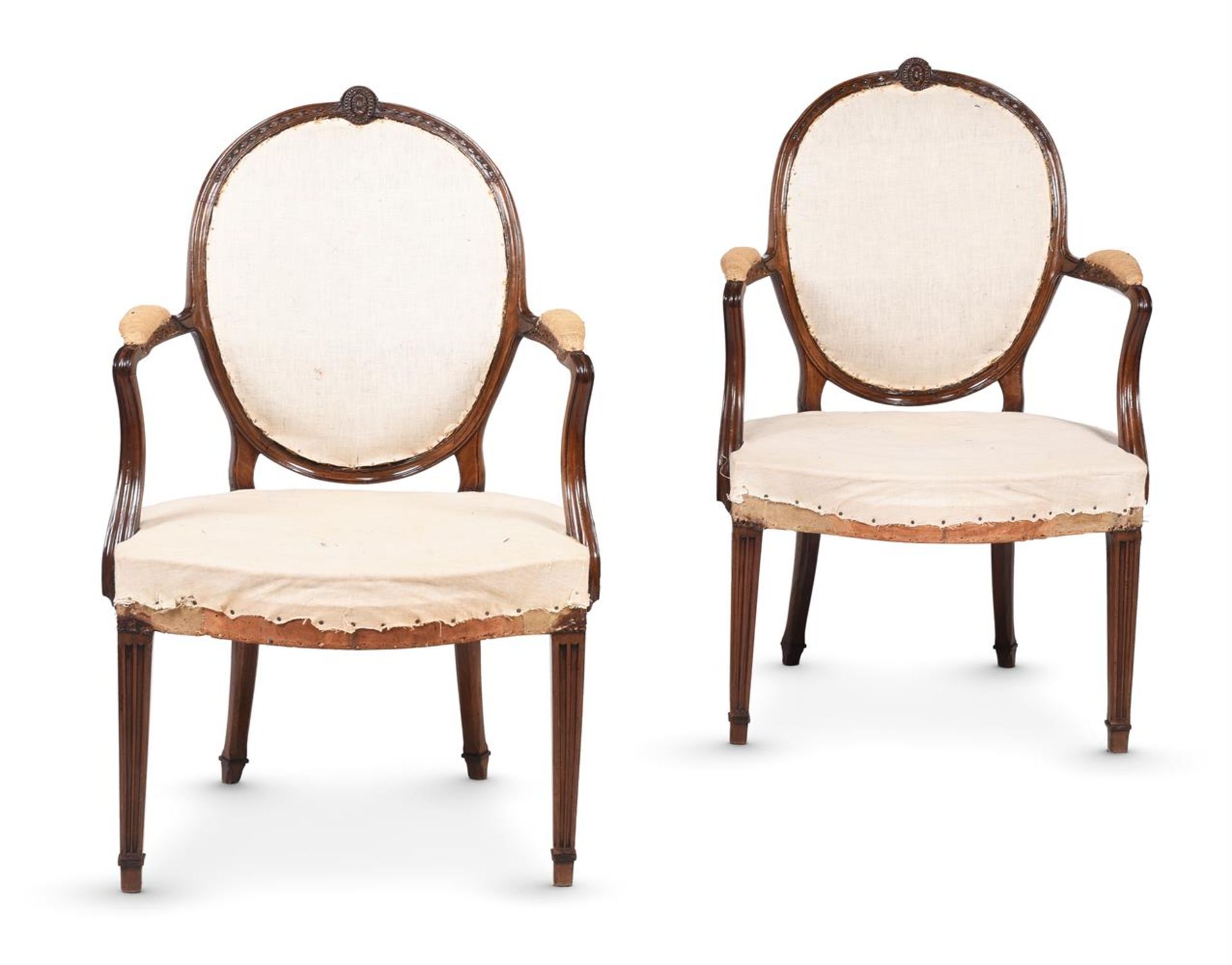 A PAIR OF GEORGE III MAHOGANY ARMCHAIRS, IN THE MANNER OF GEORGE HEPPLEWHITE, CIRCA 1780