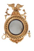 A REGENCY GILTWOOD CONVEX WALL MIRROR, CIRCA 1815