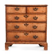 A GEORGE II WALNUT AND CROSSBANDED CHEST OF DRAWERS, MID 18TH CENTURY