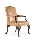 A GEORGE III CARVED MAHOGANY AND UPHOLSTERED ARMCHAIR, IN THE MANNER OF WRIGHT & ELWICK