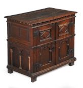 AN UNUSUAL COMMONWEALTH OAK ENCLOSED CHEST OF DRAWERS, CIRCA 1650 AND LATER
