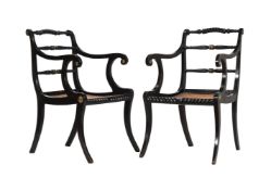 A PAIR OF REGENCY EBONISED AND BRASS INLAID ARMCHAIRS, EARLY 19TH CENTURY