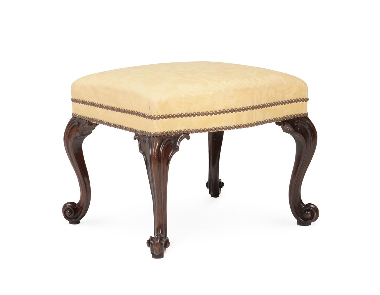 A GEORGE III MAHOGANY AND UPHOLSTERED STOOL, IN THE MANNER OF THOMAS CHIPPENDALE, CIRCA 1770