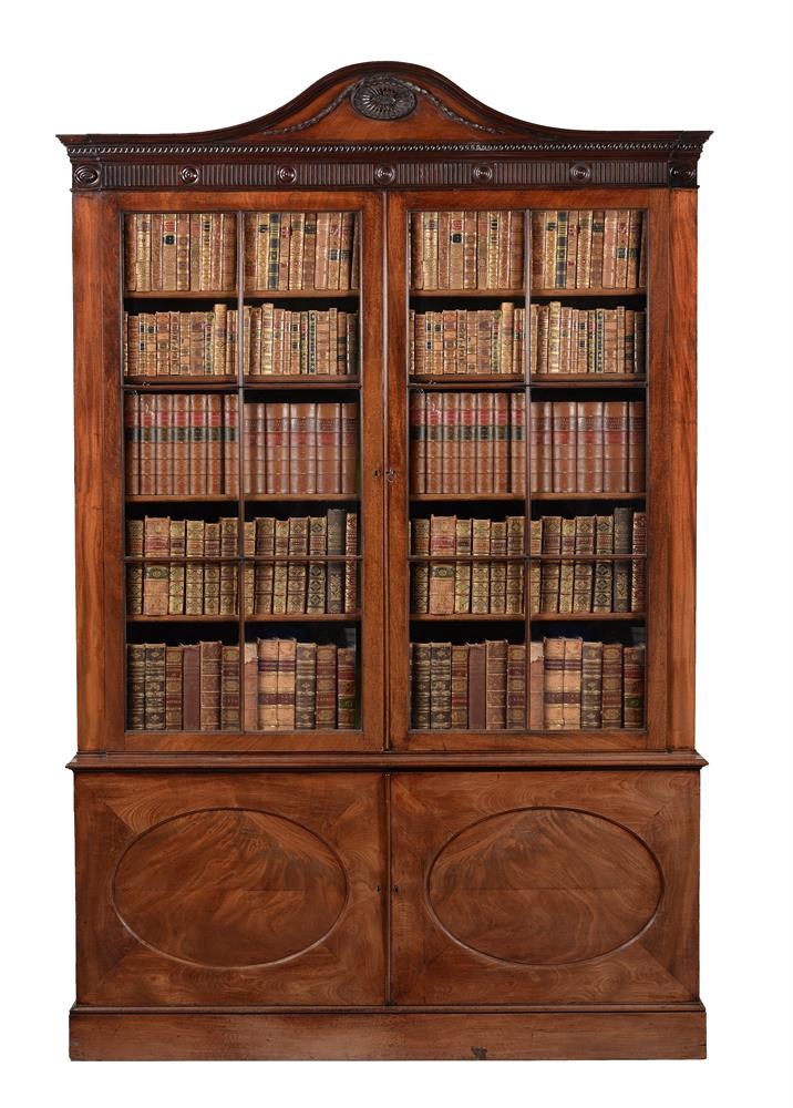 A GEORGE III MAHOGANY LIBRARY BOOKCASE, IN THE MANNER OF THOMAS CHIPPENDALE THE YOUNGER