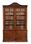 A GEORGE III MAHOGANY LIBRARY BOOKCASE, IN THE MANNER OF THOMAS CHIPPENDALE THE YOUNGER