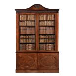 A GEORGE III MAHOGANY LIBRARY BOOKCASE, IN THE MANNER OF THOMAS CHIPPENDALE THE YOUNGER