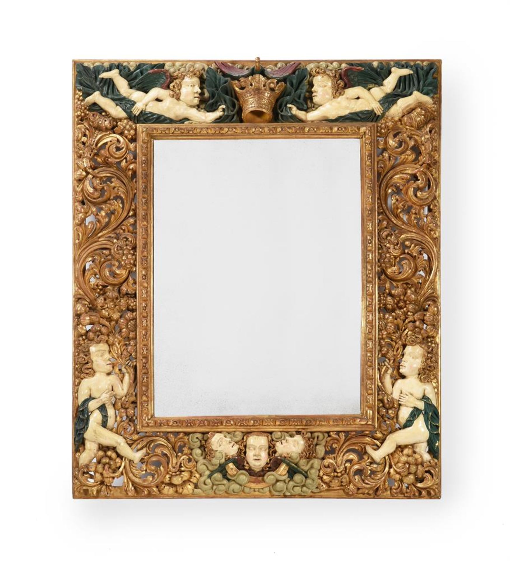 A CONTINENTAL CARVED GILTWOOD AND PAINTED MIRROR, SOUTH GERMAN OR AUSTRIAN, 17TH CENTURY AND LATER