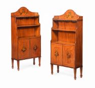 Y A PAIR OF EDWARDIAN SATINWOOD AND POLYCHROME PAINTED WATERFALL OPEN BOOKCASES, CIRCA 1905