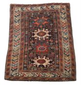 A CAUCASIAN LESGHI RUG, EARLY 20TH CENTURY, approximately 139 x 114cm