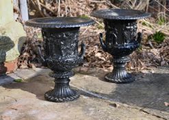 A PAIR OF BLACK PAINTED CAST IRON MEDICI URNS, 19TH CENTURY