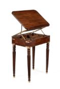 A REGENCY MAHOGANY AND BRASS BOUND CAMPAIGN READING TABLE, CIRCA 1815