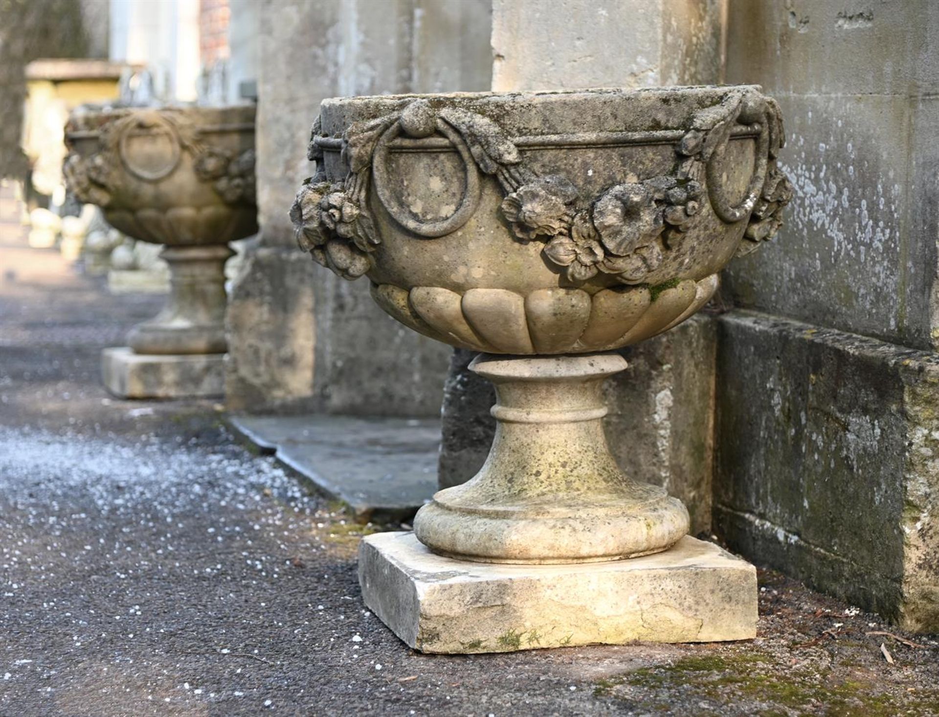 A PAIR OF STONE COMPOSITION URNS, 20TH CENTURY