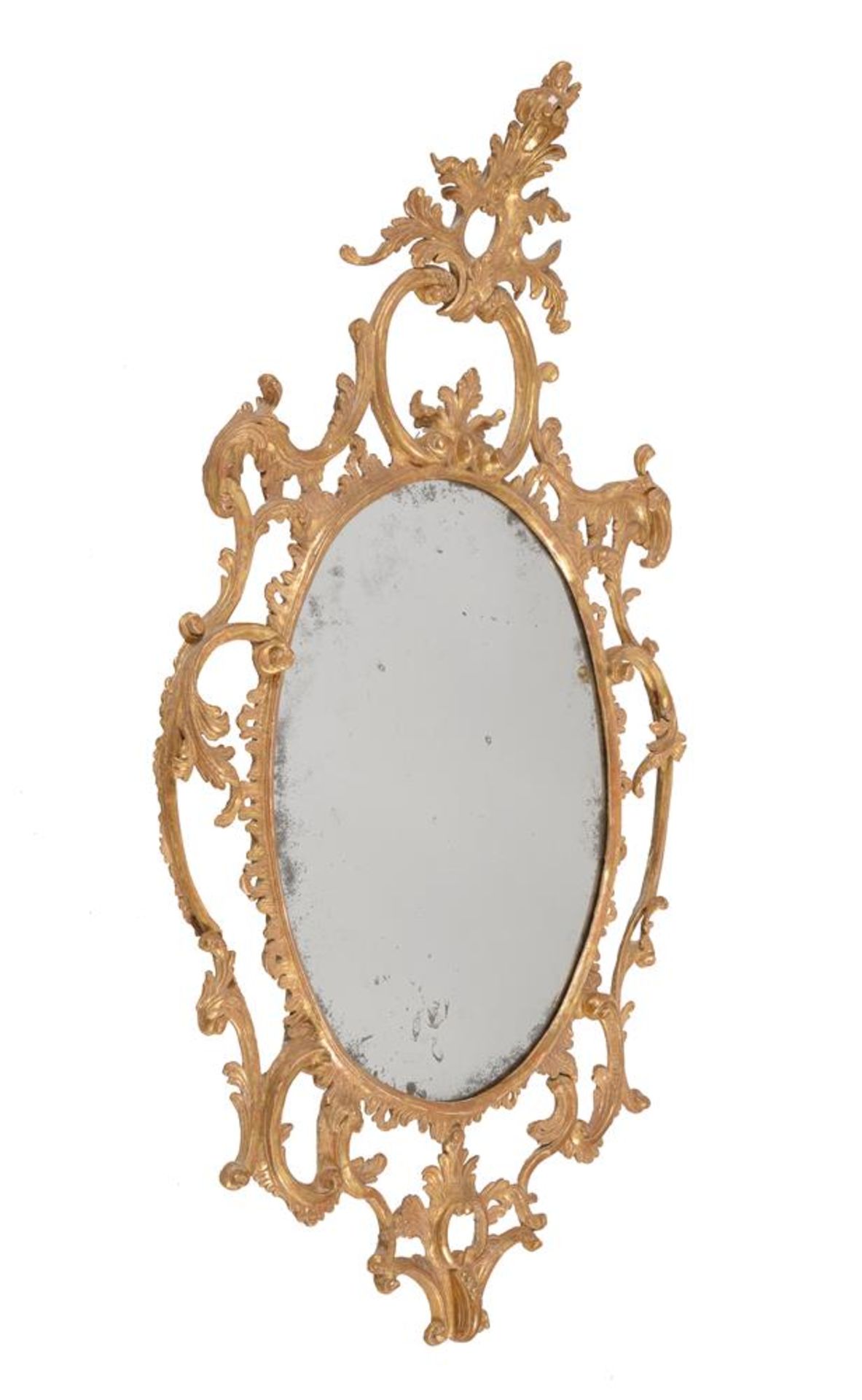 A GEORGE III CARVED GILTWOOD OVAL MIRROR, CIRCA 1765