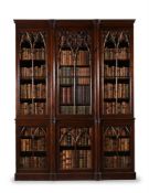 A VICTORIAN 'GOTHIC' OAK BREAKFRONT BOOKCASE, MID 19TH CENTURY