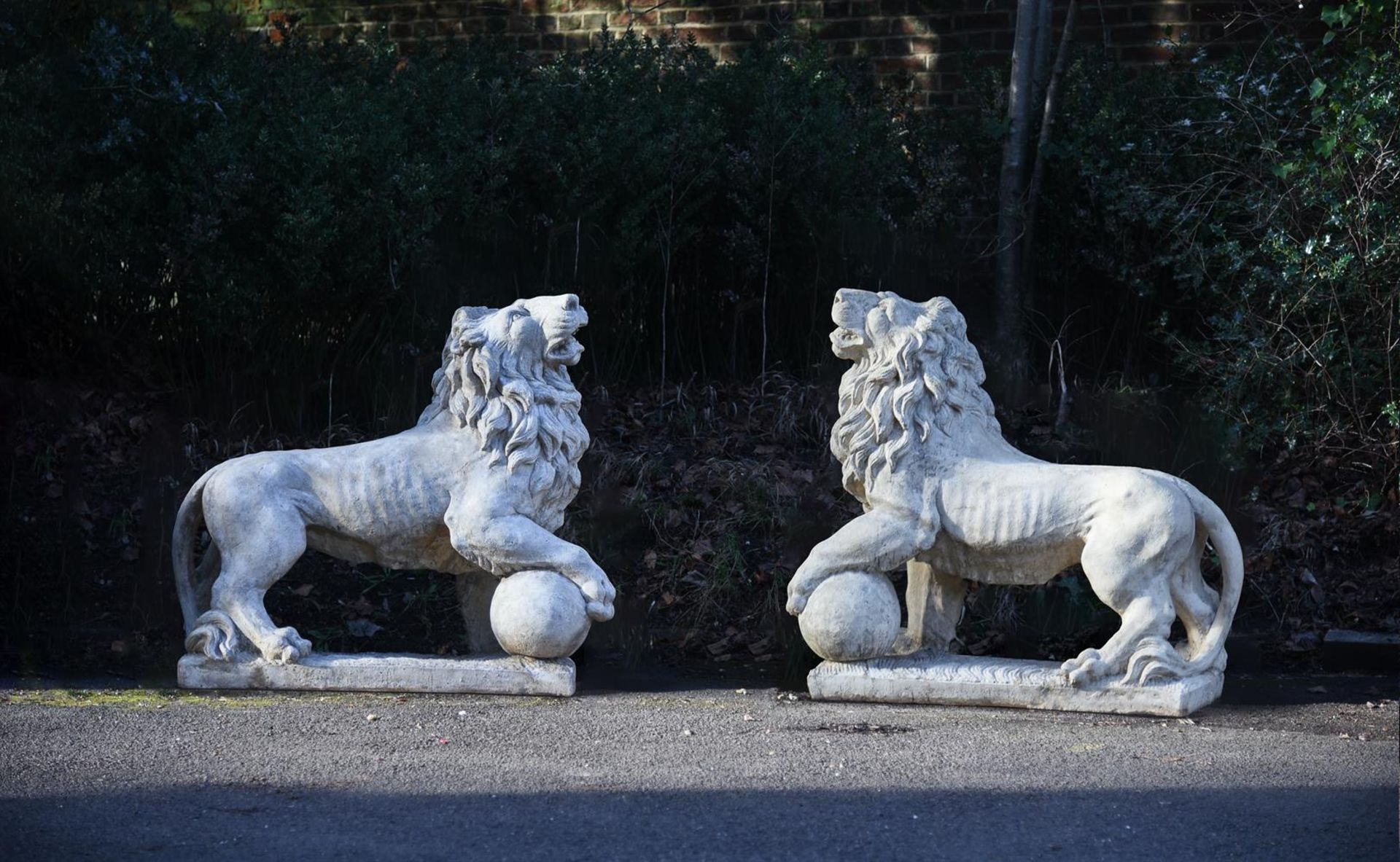 A LARGE PAIR OF COMPOSITE WHITE STONE MEDICI LIONS, 20TH CENTURY