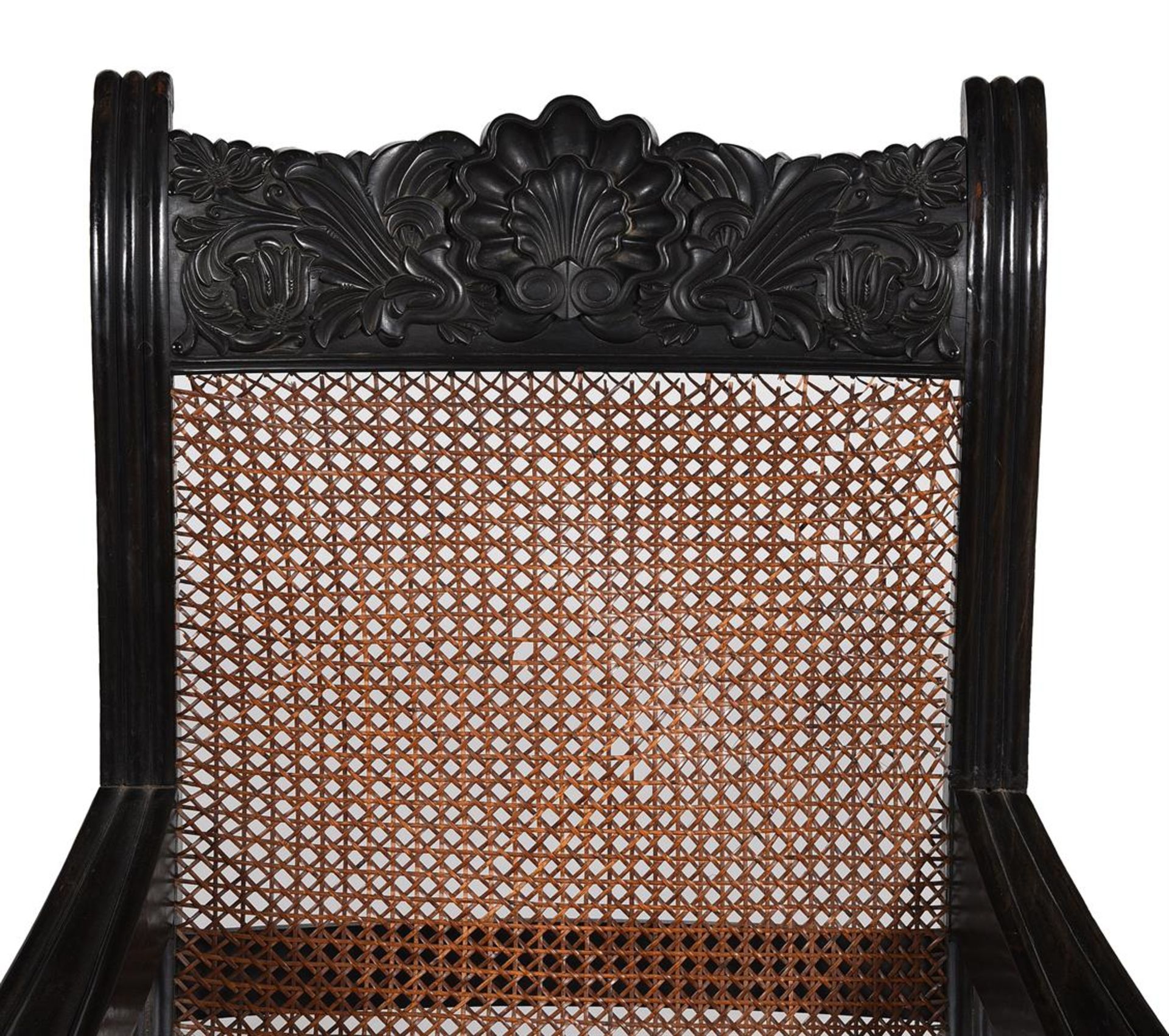 Y A NEAR PAIR OF ANGLO INDIAN CARVED EBONY ARMCHAIRS, MID 19TH CENTURY - Image 6 of 9