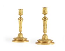 A PAIR OF FRENCH ORMOLU CANDLESTICKS, IN THE MANNER OF HENRI DASSON, LATE 19TH CENTURY