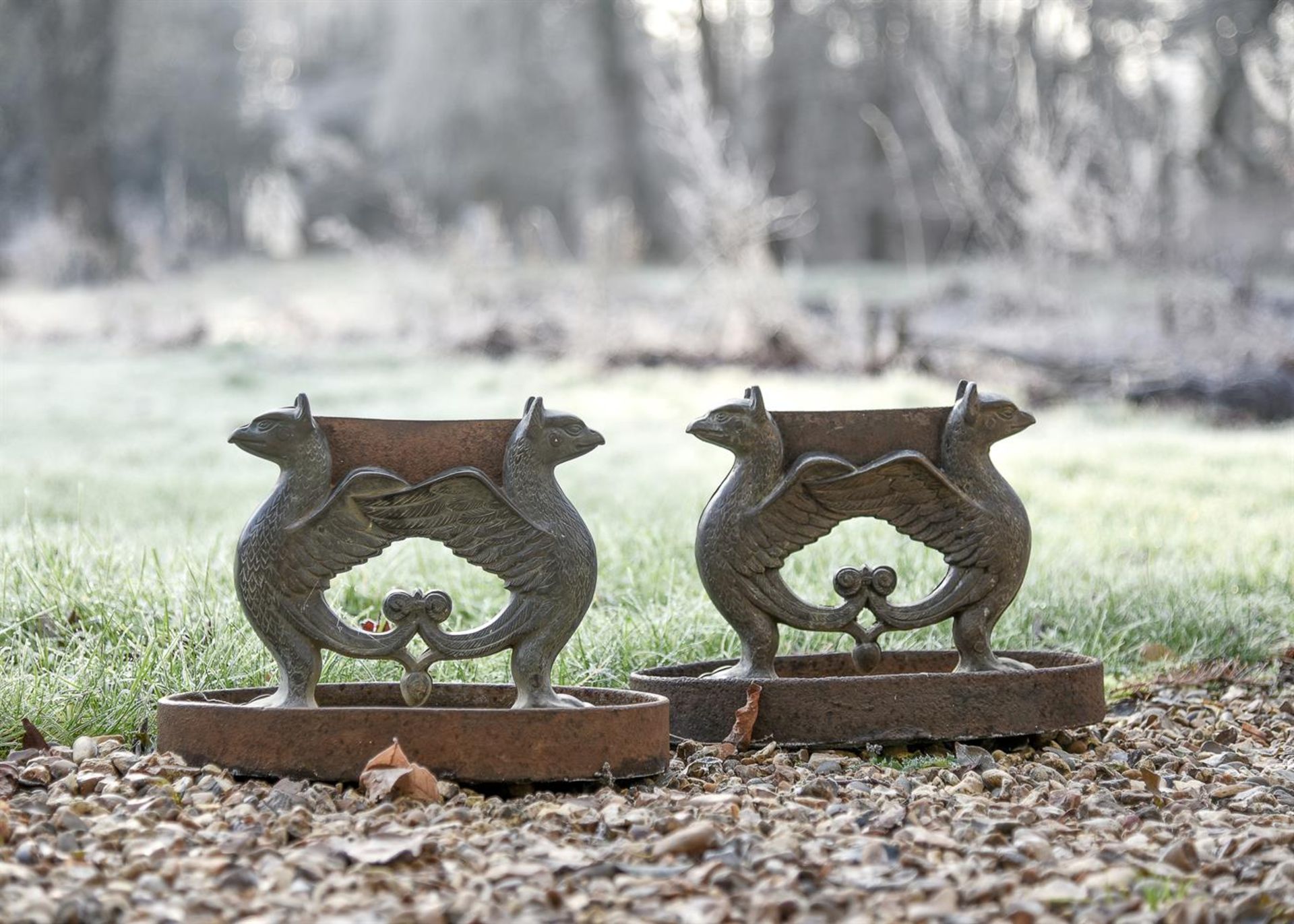 A PAIR OF BRONZE AND CAST IRON GRIFFIN BOOT SCRAPERS, 19TH CENTURY