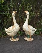 A PAIR OF PAINTED CAST IRON GEESE, 20TH CENTURY