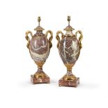 A LARGE PAIR OF BRECHE VIOLETTE AND ORMOLU MOUNTED URNS AFTER GOUTHIERE, LATE 19TH CENTURY