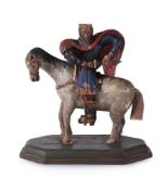 A CARVED POLYCHROME FIGURE OF ST MARTIN ON HORSEBACK, 16TH/17TH CENTURY