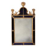 A CONTINENTAL GILT COMPOSITION, GILTWOOD AND BLUE GLASS MOUNTED MIRROR, 19TH CENTURY