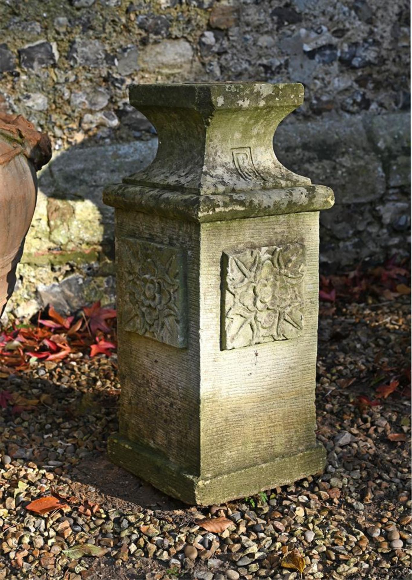 A CARVED LIMESTONE SQUARE SECTION PEDESTAL, LATE 19TH/EARLY 20TH CENTURY