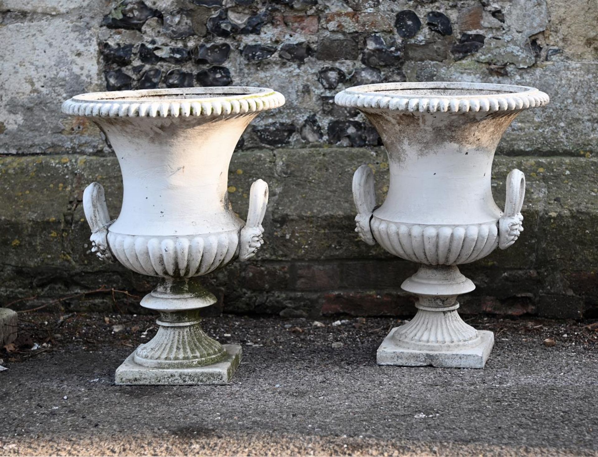 A PAIR OF CAST IRON CAMPANA URNS, 19TH CENTURY