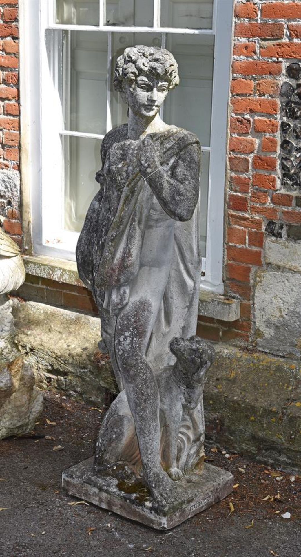 A STONE COMPOSITION FIGURE OF APOLLO, LATE 20TH CENTURY