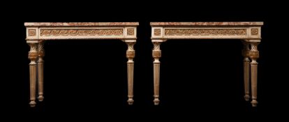 A PAIR OF CONTINENTAL CREAM PAINTED AND PARCEL-GILT CONSOLE TABLES, LATE 18TH/19TH CENTURY
