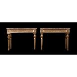 A PAIR OF CONTINENTAL CREAM PAINTED AND PARCEL-GILT CONSOLE TABLES, LATE 18TH/19TH CENTURY