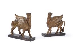A PAIR OF BRONZE MODELS OF THE ASSYRIAN SPHINX, LATE 19TH/EARLY 20TH CENTURY