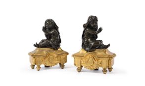 A PAIR OF FRENCH GILT AND PATINATED BRONZE CHENETS, 19TH CENTURY, IN THE MANNER OF PRIEUR
