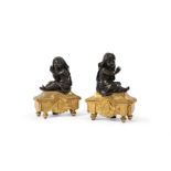 A PAIR OF FRENCH GILT AND PATINATED BRONZE CHENETS, 19TH CENTURY, IN THE MANNER OF PRIEUR