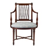 A GEORGE III MAHOGANY OPEN ARMCHAIR IN THE MANNER OF THOMAS SHERATON