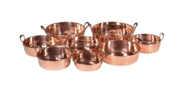 A HARLEQUIN SET OF EIGHT GRADUATED COPPER JAM PANS