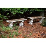 A PAIR OF COMPOSITE STONE BENCHES