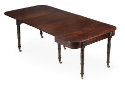 A GEORGE IV MAHOGANY CONCERTINA ACTION EXTENDING DINING TABLE