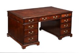 A MAHOGANY PARTNER'S PEDESTAL DESK IN GEORGE III STYLE