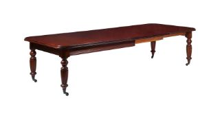 A MAHOGANY EXTENDING DINING TABLE IN VICTORIAN STYLE