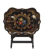 A VICTORIAN BLACK LACQUER AND PARCEL GILT PAPIER MACHE TRAY TOP TABLE