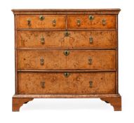 AN ELM AND BURR ELM CHEST OF DRAWERS