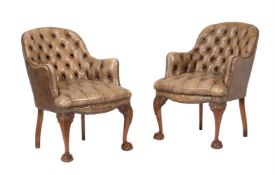A PAIR OF LEATHER UPHOLSTERED ARMCHAIRS