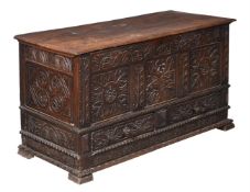 A CARVED OAK CHEST