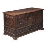 A CARVED OAK CHEST