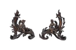 A PAIR OF BRONZE CHENETS IN LOUIS XV ROCOCO STYLE