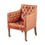 A MAHOGANY AND MOROCCO LEATHER LIBRARY ARMCHAIR IN GEORGE III STYLE