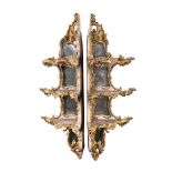 A PAIR OF GILTWOOD AND COMPOSITION CORNER WALL SHELVES IN ROCOCO STYLE