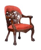 A CONTINENTAL MAHOGANY AND RED SUEDE UPHOLSTERED ARMCHAIR IN EMPIRE STYLE