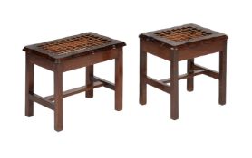 A MATCHED PAIR OF TEAK LUGGAGE STANDS